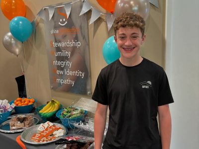 Boy smiling showing off his braces 