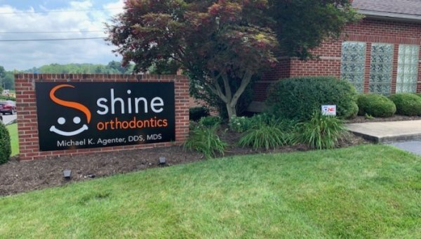 Shine Orthodontics outdoor sign and flower bed