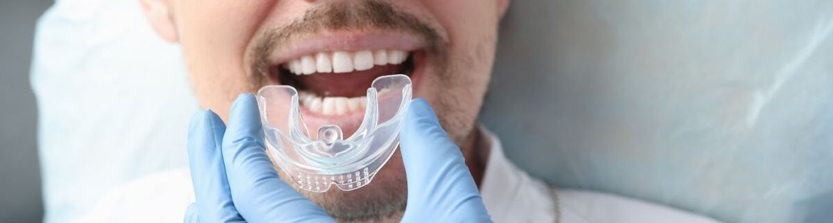 Putting mouthguard on